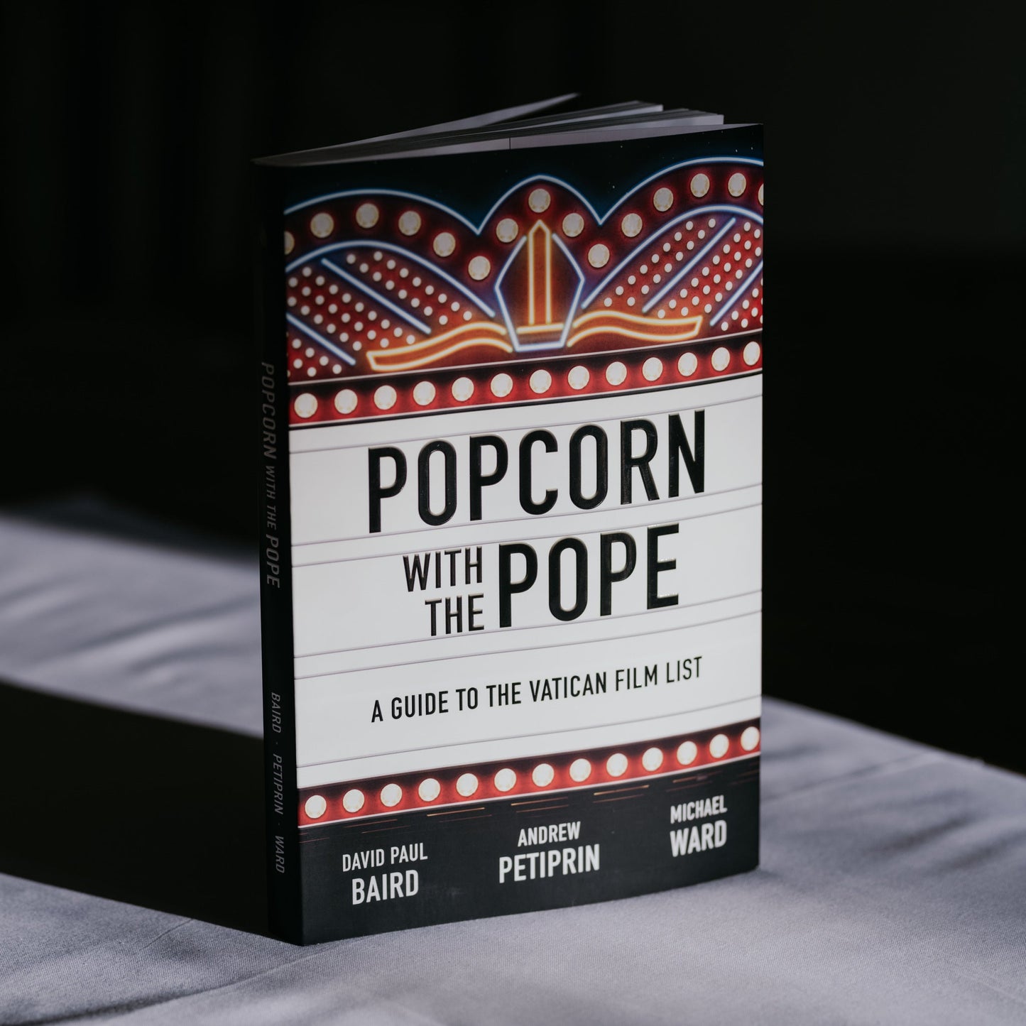 https://cdn.shopify.com/s/files/1/0005/3195/5769/files/2311_Popcorn-with-the-pope-3.jpg?v=1758317559